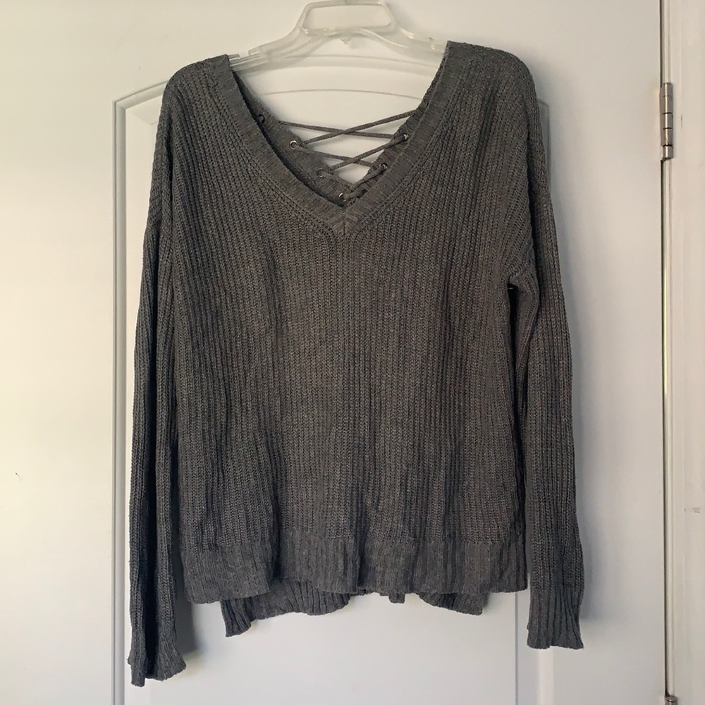 Grey V-neck sweater with laced up back